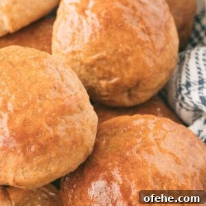 Whole Wheat Dinner Rolls Made in a Bread Machine 9 three wheat rolls clustered together.