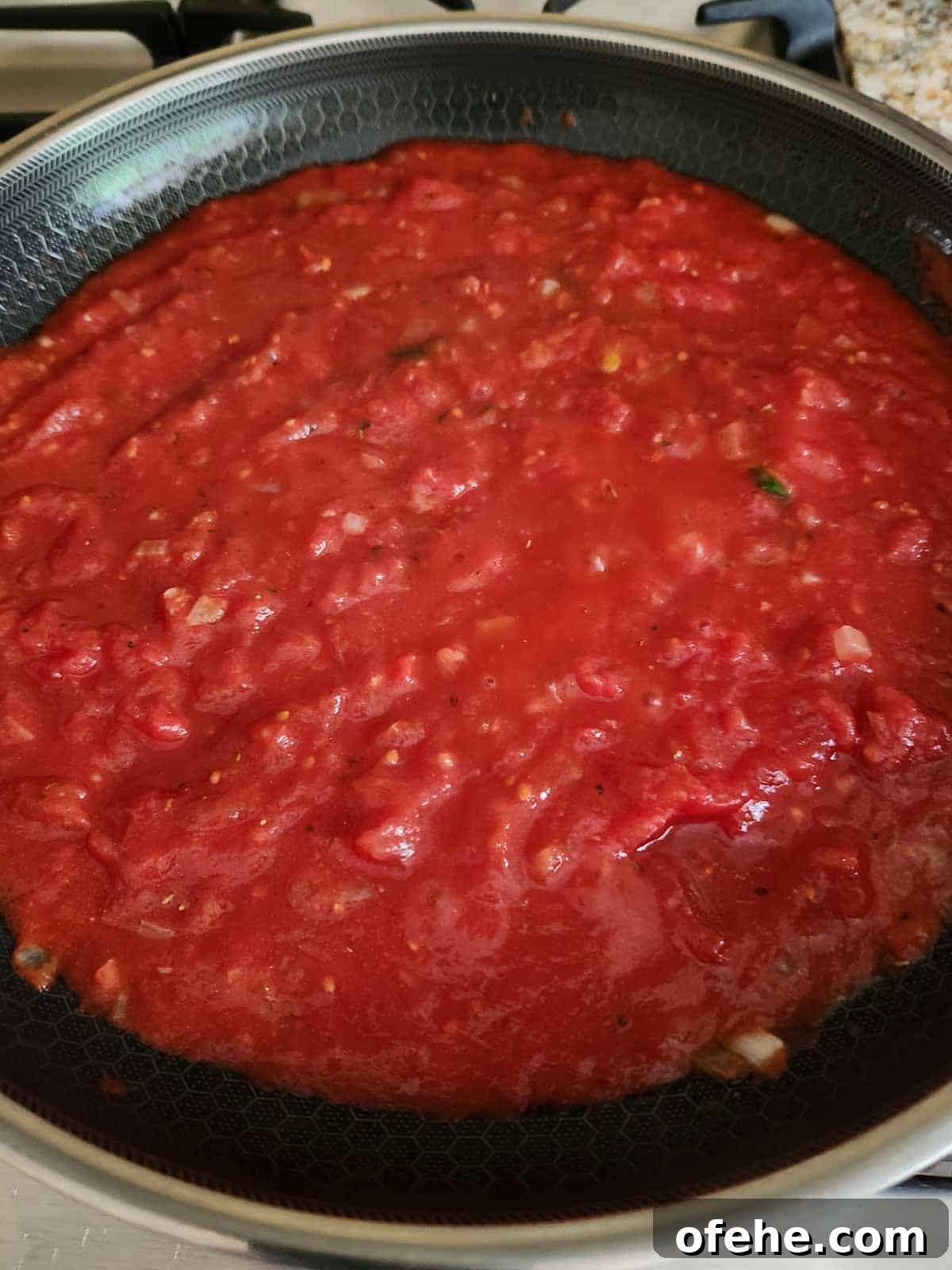 Poached Eggs in Spicy Tomato Sauce (Eggs in Purgatory) 6 Seasoning the tomato sauce with herbs.