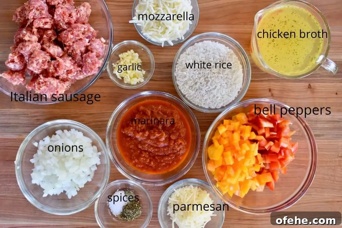 One-Pan Stuffed Pepper Skillet with Ground Beef and Rice 3 overhead photo of all of the ingredients that go into this recipe including Italian sausage, rice, cheese, and marinara sauce.