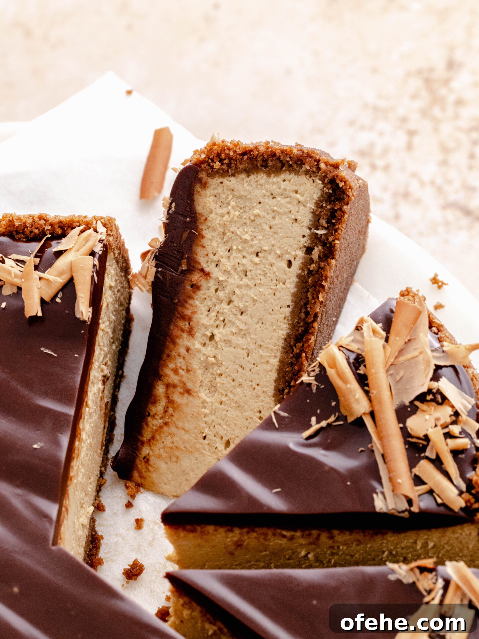 Decadent Coffee Cheesecake Recipe for Coffee Lovers 5 Espresso cheesecake cut into slices with on of the titled to side.