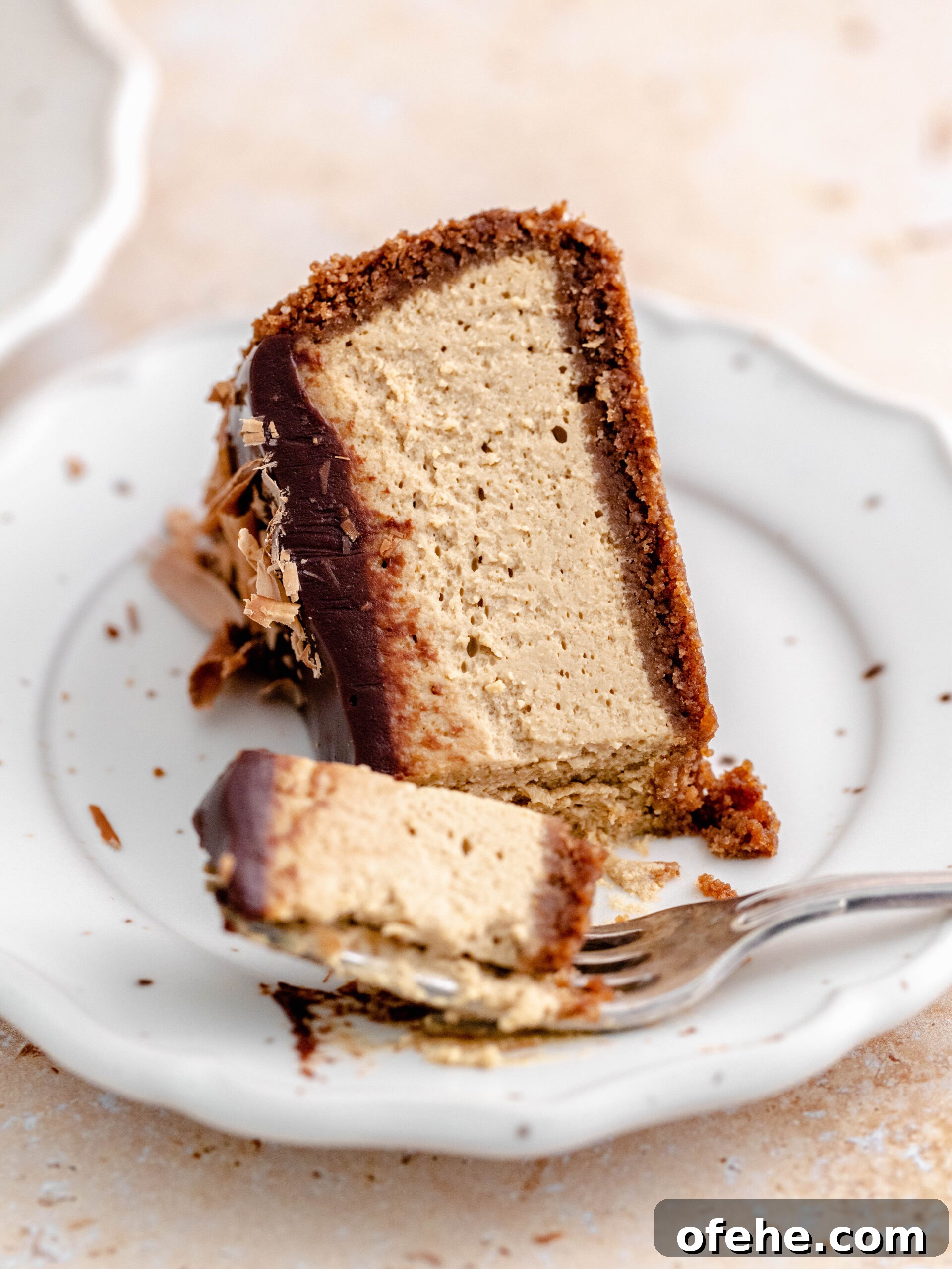 Decadent Coffee Cheesecake Recipe for Coffee Lovers 7 Cheesecake slice on a plate.