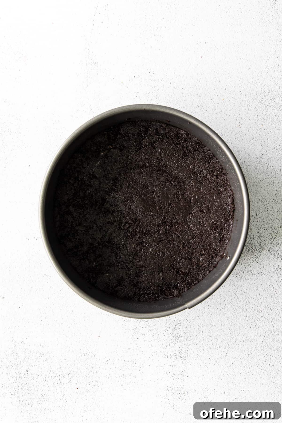 chocolate cheesecake crust in pan