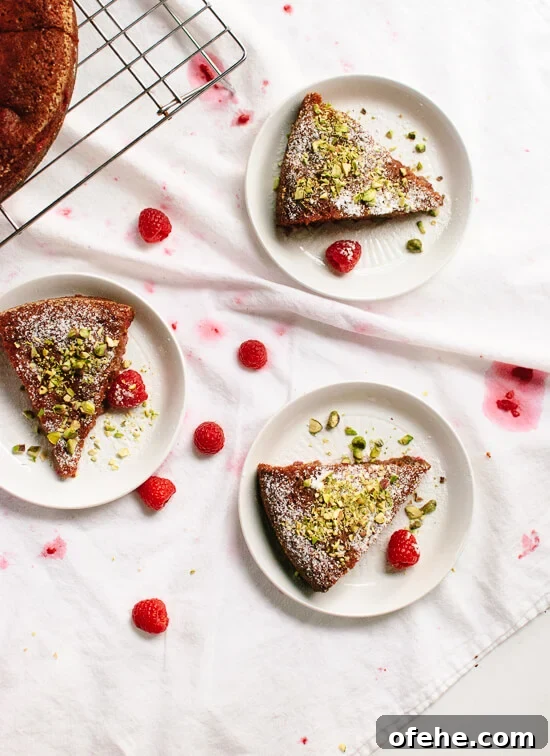 Honey Almond Cake with Raspberries, Orange & Pistachios 2 A delightfully simple and delicious gluten-free, naturally sweetened cake flavored with orange and raspberries! cookieandkate.com