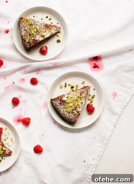 Honey Almond Cake with Raspberries, Orange & Pistachios 10 Flourless orange and raspberry cake made with almond meal and sweetened with honey! cookieandkate.com