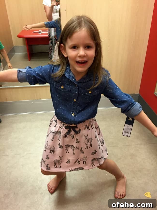 a little girl trying on clothes at Target.