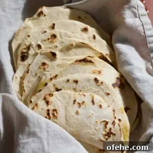 Sourdough Discard Tortillas wrapped in a kitchen towel.