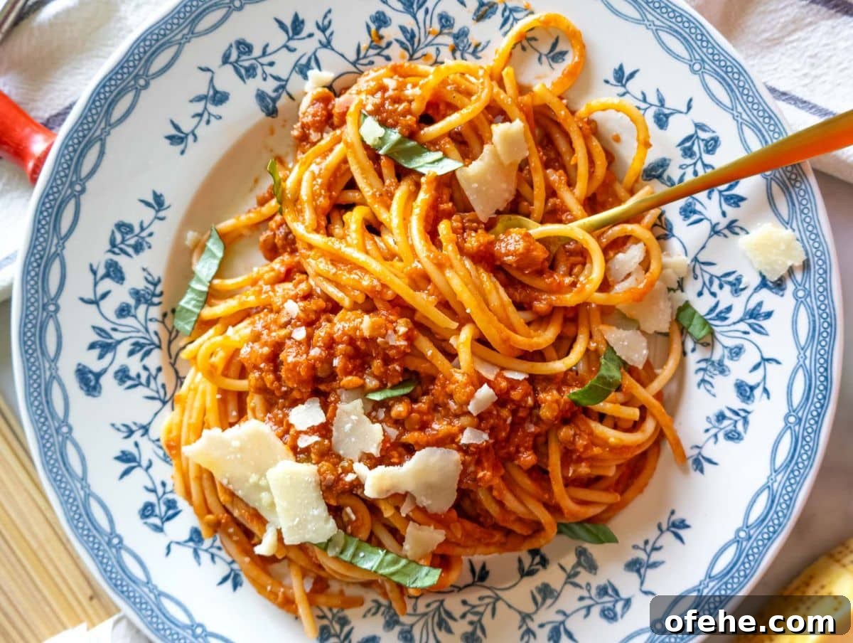 30-Minute Dinners We Cook on Busy Weeknights 17 One pot easy lentil bolognese with spaghetti on a rustic table.