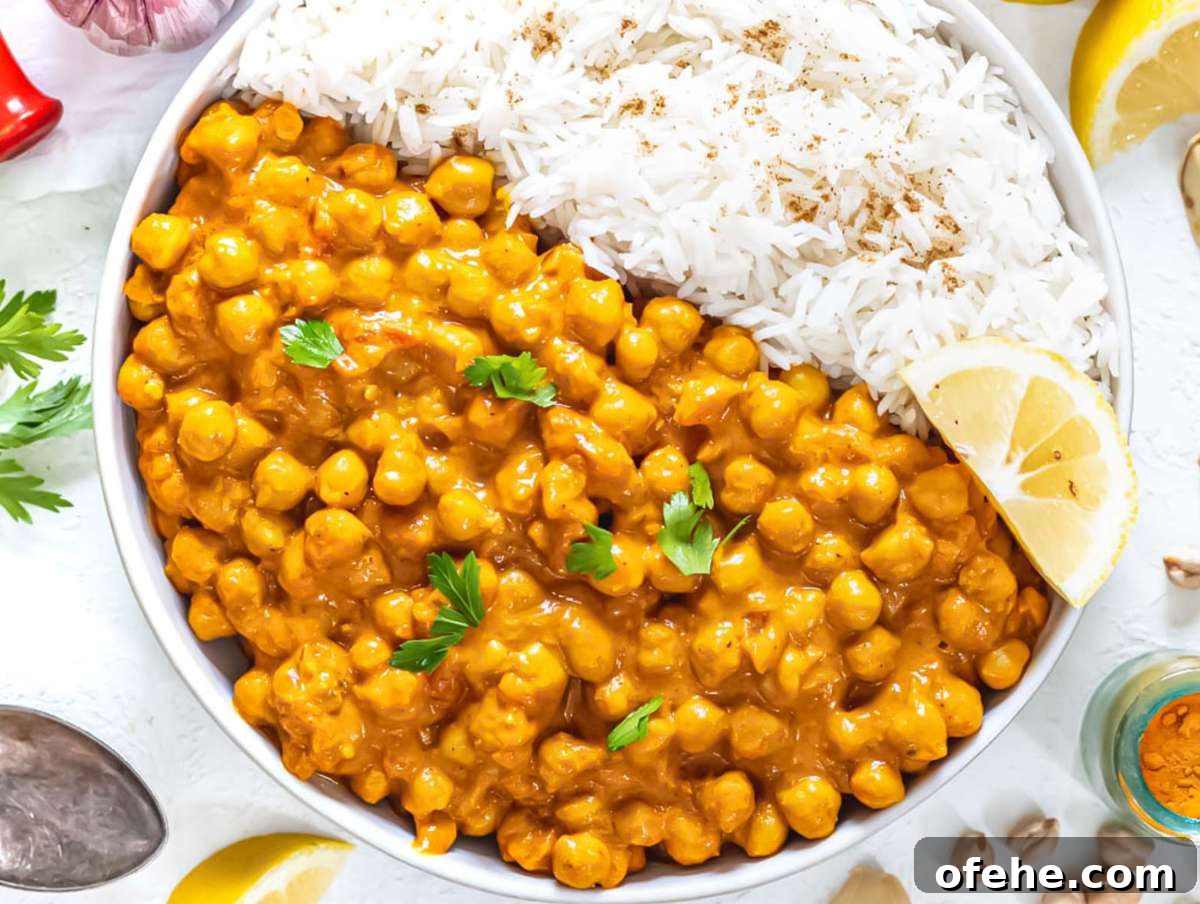 30-Minute Dinners We Cook on Busy Weeknights 3 Step 3 Serve coconut curry with chickpeas in bowl with rice cilantro and yogurt topping.