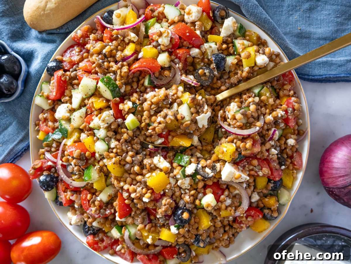 30-Minute Dinners We Cook on Busy Weeknights 21 Step 4 Greek lentil salad with feta crumbled in served on a large platter.