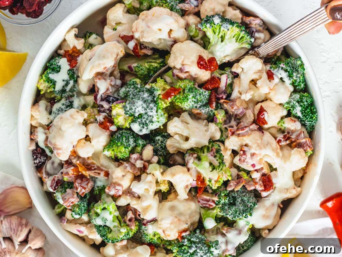 30-Minute Dinners We Cook on Busy Weeknights 25 Step 4 Tossing healthy broccoli cauliflower salad with creamy Greek yogurt dressing before chilling.