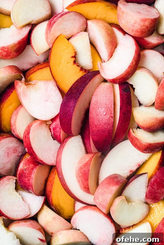 Quick Pickled Fruit: Perfect Brine Ratio for Every Batch 13 peaches! overhead shot of different varieties of fresh and raw peaches, cut into wedges.