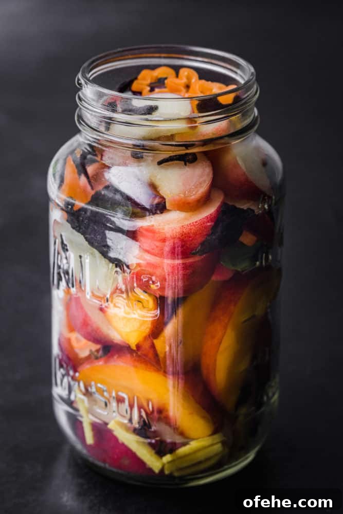 Quick Pickled Fruit: Perfect Brine Ratio for Every Batch 7 Pickled peaches! Peaches in a jar with basil, habanero, cloves and ginger; in process shot , pre-bring being poured into jar.