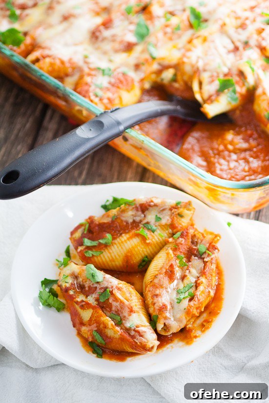 5 Cheese Stuffed Shells Recipe is an easy pasta recipe perfect for family dinner. Classic Italian flavors featuring five different cheeses, garlic, spinach, and red sauce this 5 Cheese Stuffed Shell Recipe is creamy, cheesy, and satisfying. Perfect for a meatless family dinner recipe!