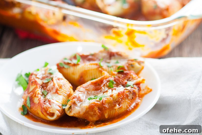 5 Cheese Stuffed Shells Recipe is an easy pasta recipe perfect for family dinner. Classic Italian flavors featuring five different cheeses, garlic, spinach, and red sauce this 5 Cheese Stuffed Shell Recipe is creamy, cheesy, and satisfying. Perfect for a meatless family dinner recipe!