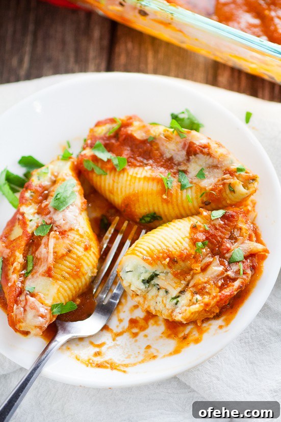 5 Cheese Stuffed Shells Recipe is an easy pasta recipe perfect for family dinner. Classic Italian flavors featuring five different cheeses, garlic, spinach, and red sauce this 5 Cheese Stuffed Shell Recipe is creamy, cheesy, and satisfying. Perfect for a meatless family dinner recipe!