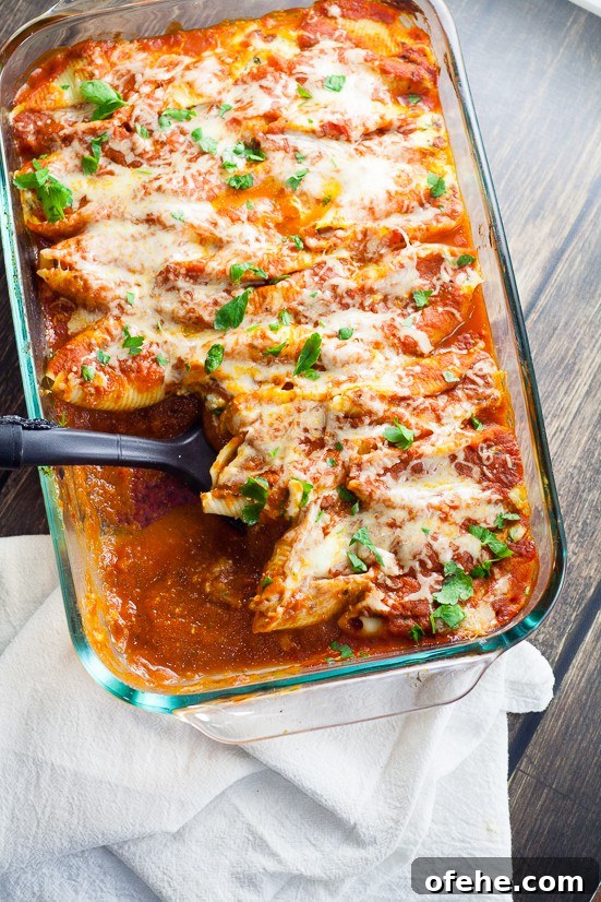 5 Cheese Stuffed Shells Recipe is an easy pasta recipe perfect for family dinner. Classic Italian flavors featuring five different cheeses, garlic, spinach, and red sauce this 5 Cheese Stuffed Shell Recipe is creamy, cheesy, and satisfying. Perfect for a meatless family dinner recipe!