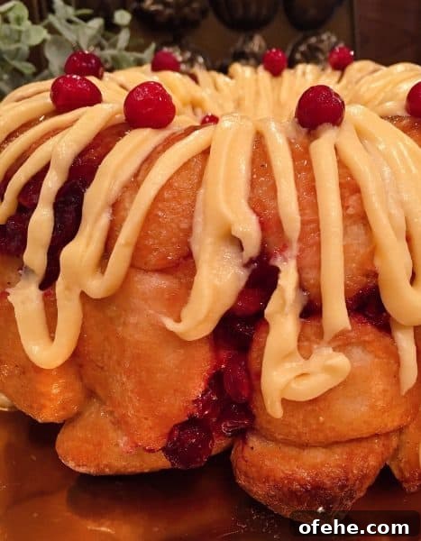 Cranberry Orange Pull-Apart Monkey Bread Recipe 13 Drizzle of orange cream cheese frosting over monkey bread