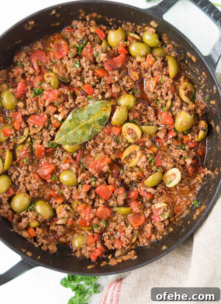 Authentic Brazilian Picadillo (Picadinho) Recipe for Dinner 5 Close up of Brazilian picadillo recipe in a black braiser from above