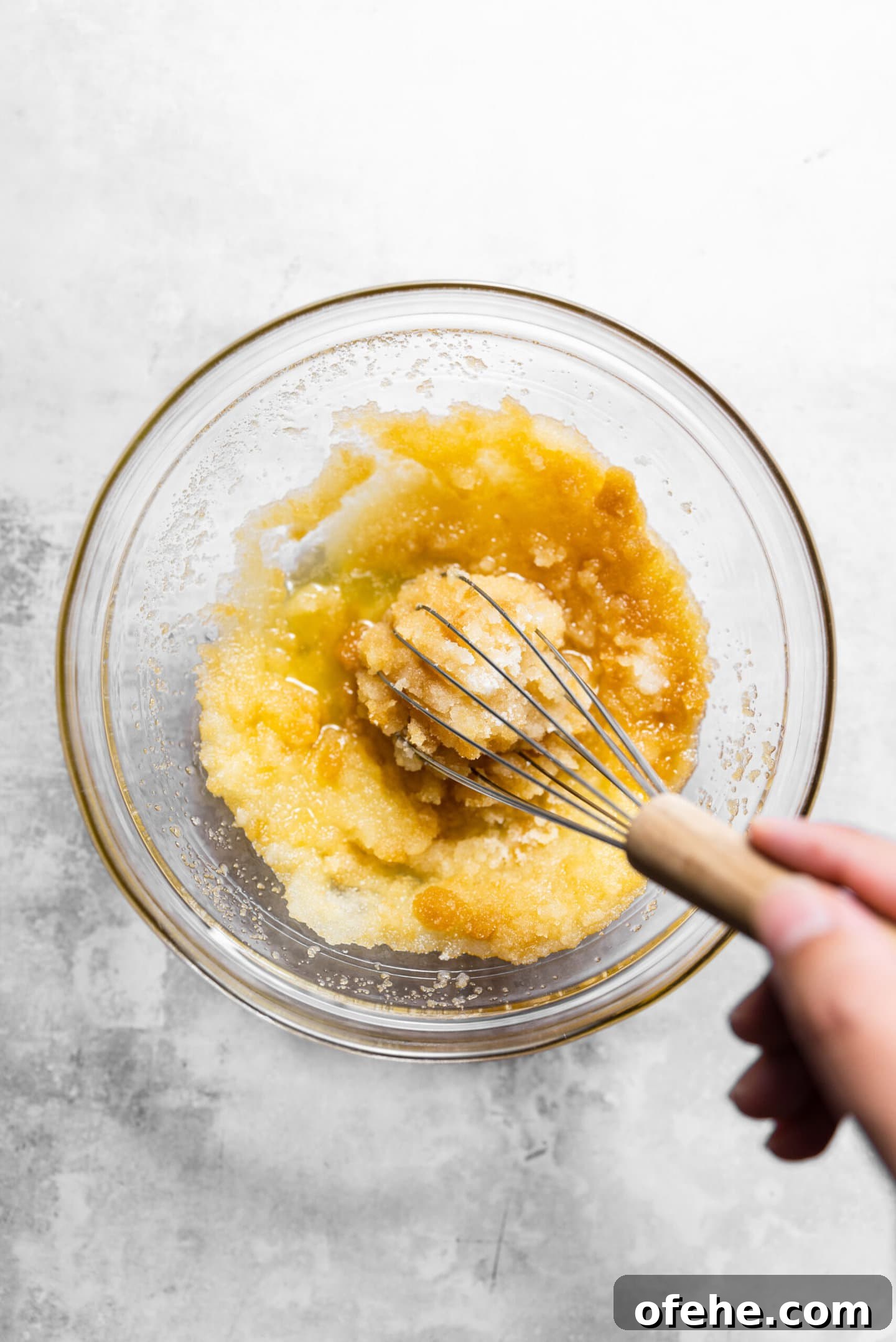 Salted Caramel Brownie Bites in a Muffin Tin 5 Butter, oil, and sugars being whisked together