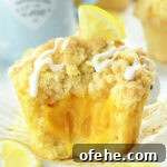 lemon curd muffins with soft crumb and gooey lemon filling inside