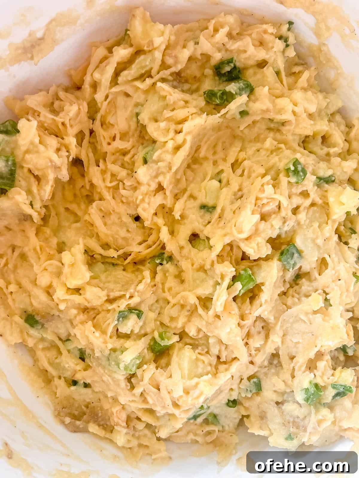Gluten-Free Potato Pancakes with Optional Whole30 Version 11 The shredded potatoes mixed into the mashed potato mixture.