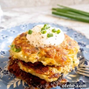 Gluten-Free Potato Pancakes with Optional Whole30 Version 16 Gluten free potato pancakes on a plate with greek yogurt on top.