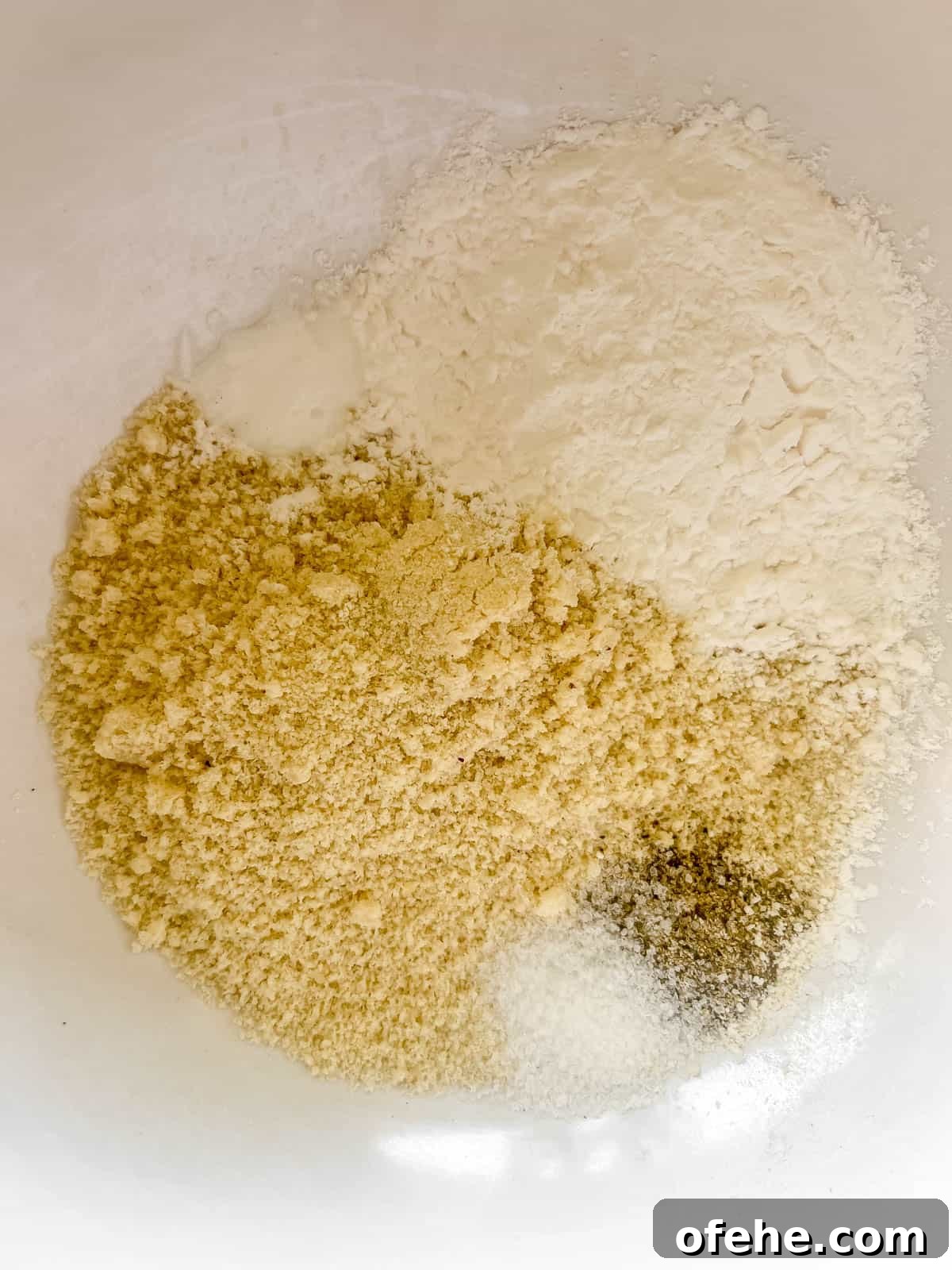 Gluten-Free Potato Pancakes with Optional Whole30 Version 7 The dry ingredients mixed together in a bowl.