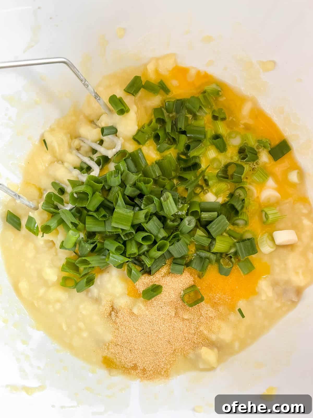Gluten-Free Potato Pancakes with Optional Whole30 Version 9 Adding pencil onions, eggs, and garlic to the mashed potatoes.