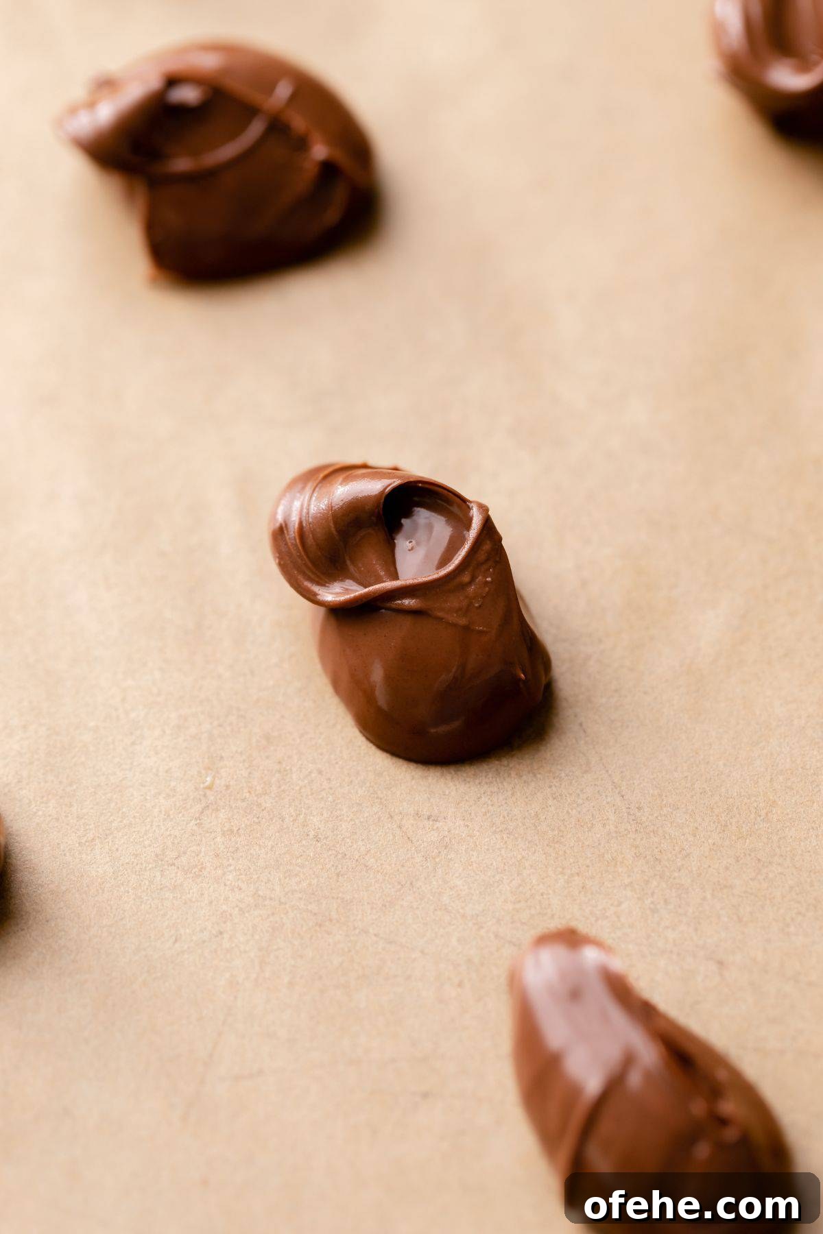 Chocolate Hazelnut Banana Muffins — Moist & Gooey Recipe 4 Scoops of nutella on a baking sheet.