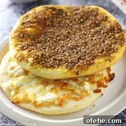 Za'atar and cheese manakeesh stacked on a light brown plate