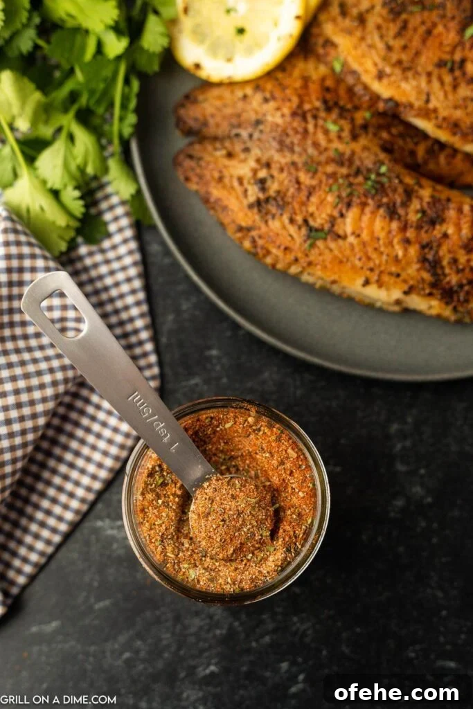 Homemade Blackened Seasoning Blend for Perfect Cajun Flavor 2 Blackened Seasoning in a jar with a teaspoon