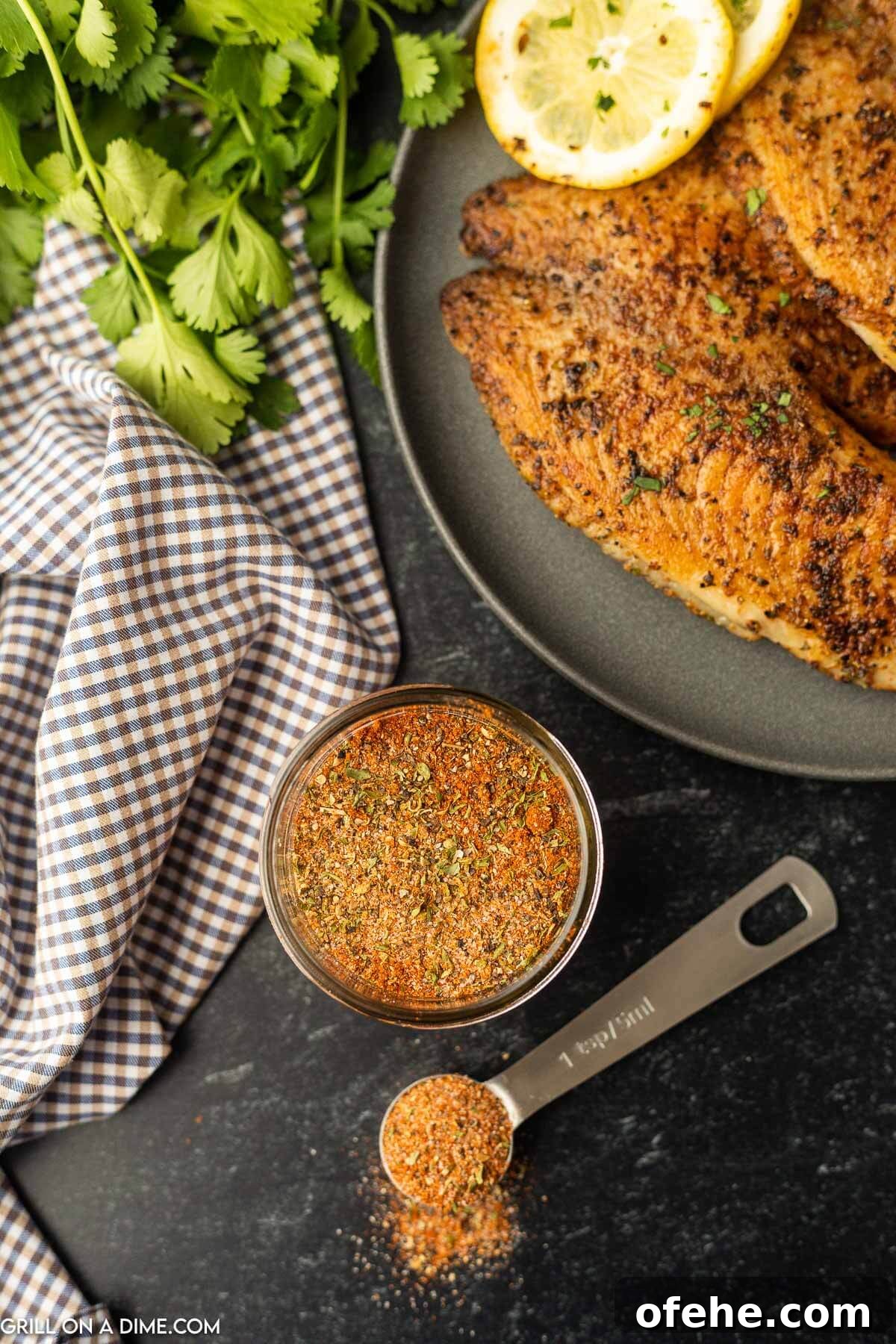 Homemade Blackened Seasoning Blend for Perfect Cajun Flavor 5 Blackened Seasoning in a jar with a teaspoon