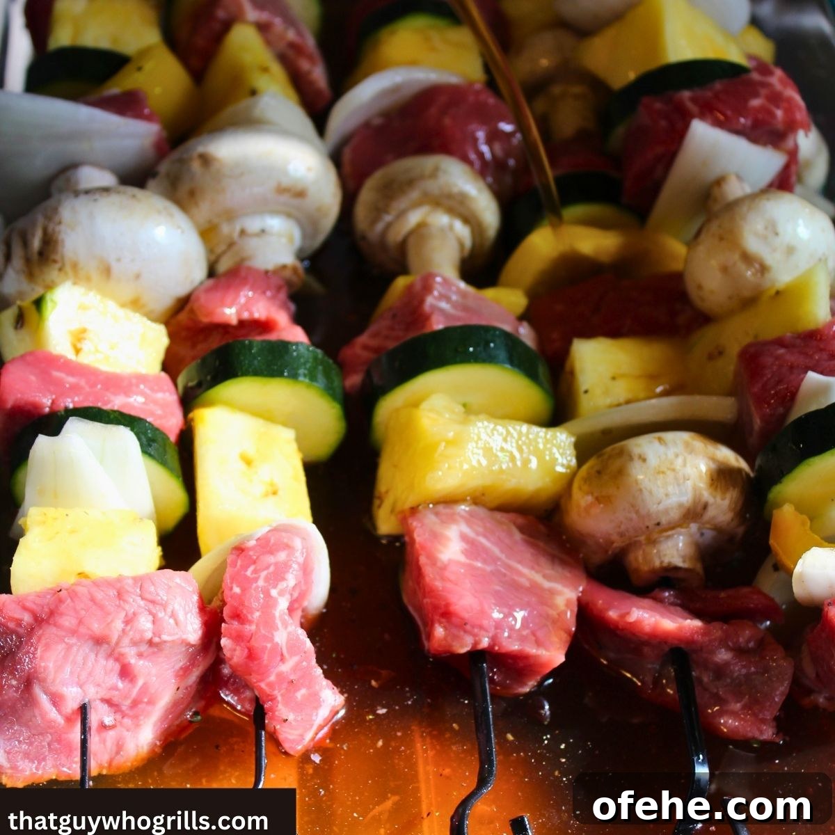Juicy Grilled Steak Kabobs with Garlic Herb Marinade 4 Steak kabobs in marinade