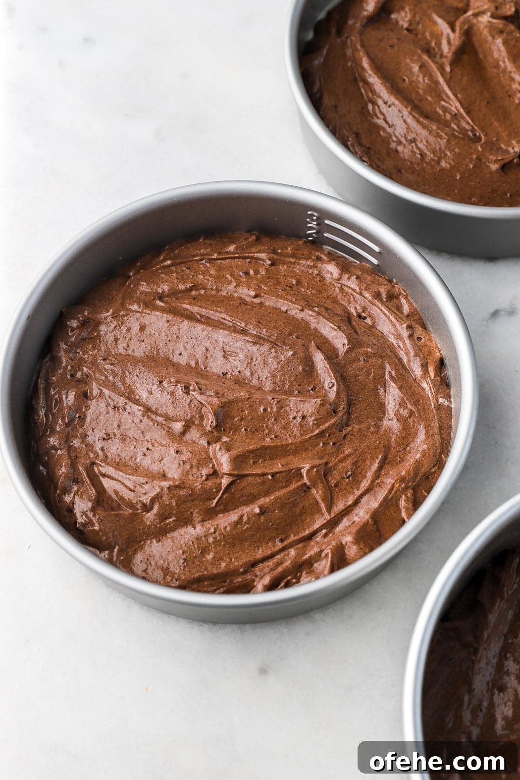 Decadent 8-Inch Chocolate Cake Recipe for Any Occasion 8 cake batter filling pans halfway