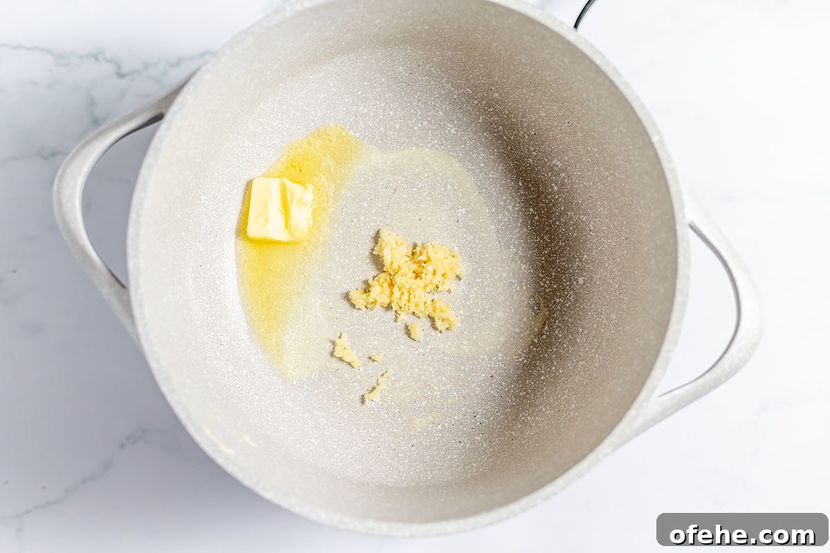 Butter and garlic in Dutch oven.