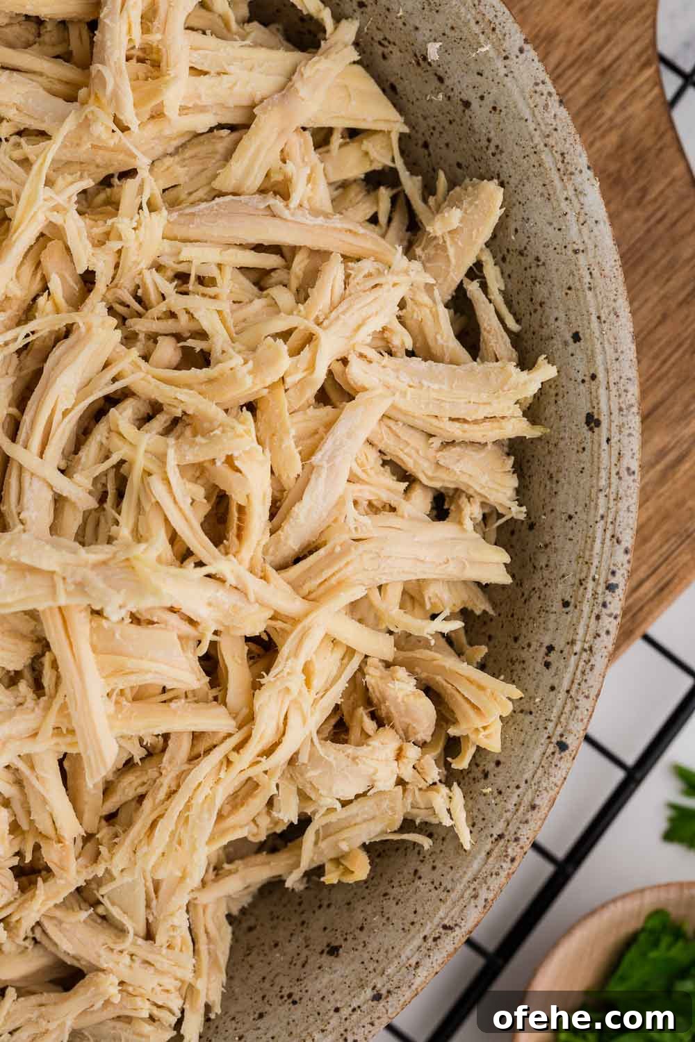 Slow Cooker Shredded Chicken Recipe for Tender, Juicy Meat 7 Close up of Slow Cooker Shredded Chicken in bowl