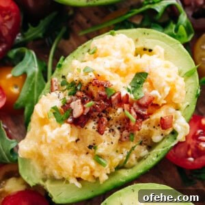 Creamy Avocado Scrambled Eggs Recipe for Quick Breakfast 13 Enjoy Soft scrambled eggs with stringy cheese and crispy bacon stuffed into avocado