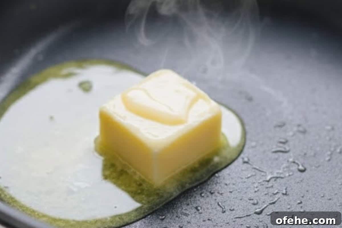 Creamy Avocado Scrambled Eggs Recipe for Quick Breakfast 8 Add butter to the same nonstick pan and let it melt over low-medium heat.