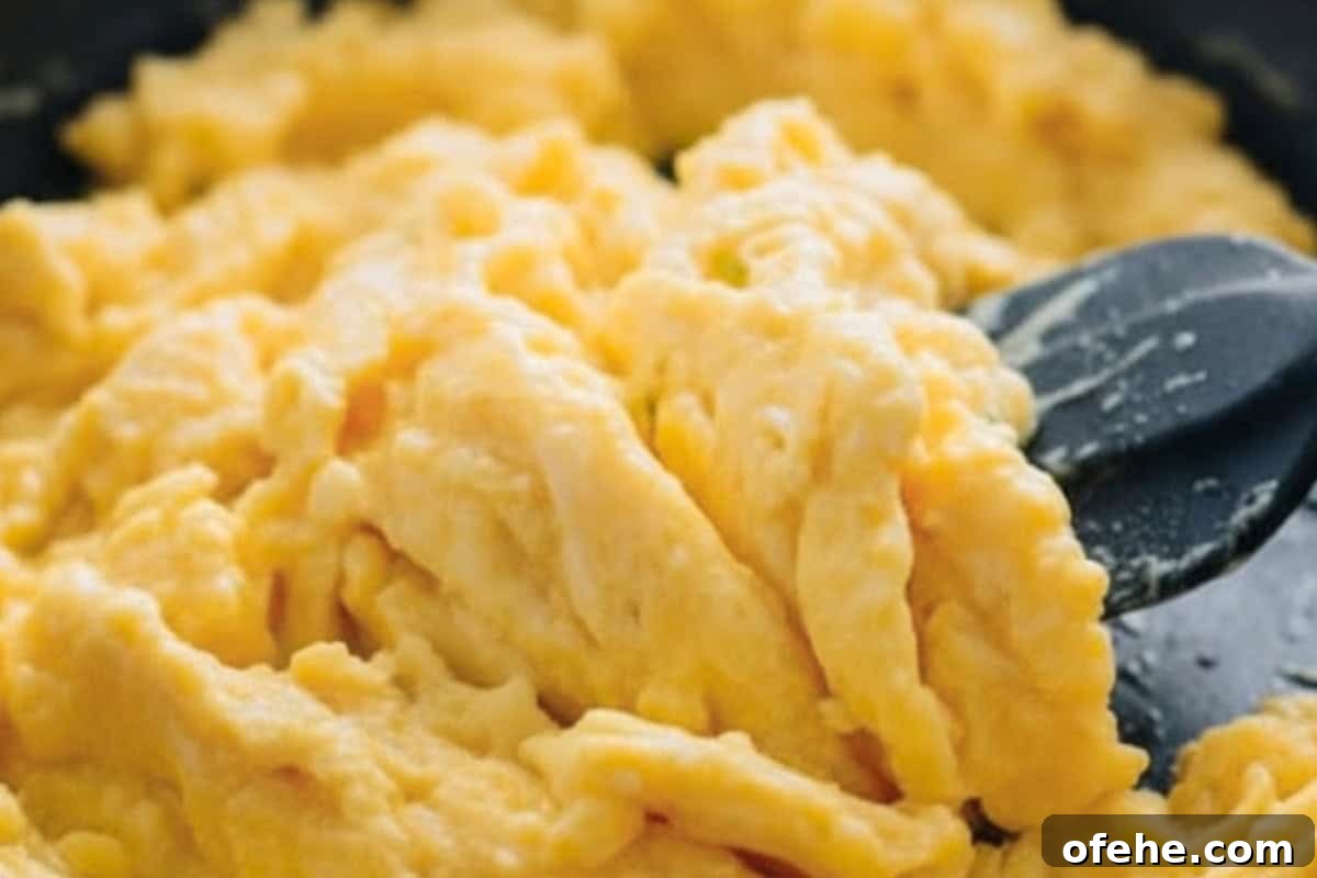 Creamy Avocado Scrambled Eggs Recipe for Quick Breakfast 9 Pour the mixture into pan and let it sit for about 5 seconds before stirring. Use a spatula to fold the eggs gently until almost set.