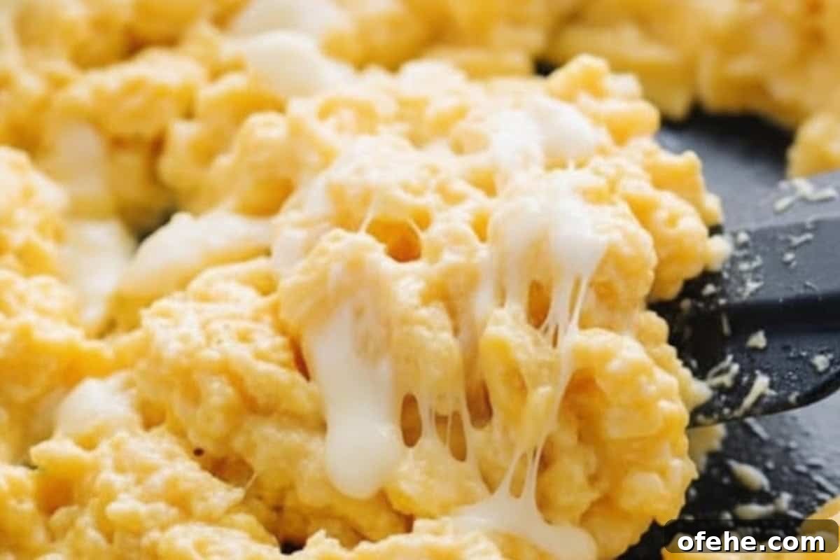 Creamy Avocado Scrambled Eggs Recipe for Quick Breakfast 10 Once the eggs are custard-like and just cooked, remove from the heat and fold in the shredded mozzarella until melted and gooey.
