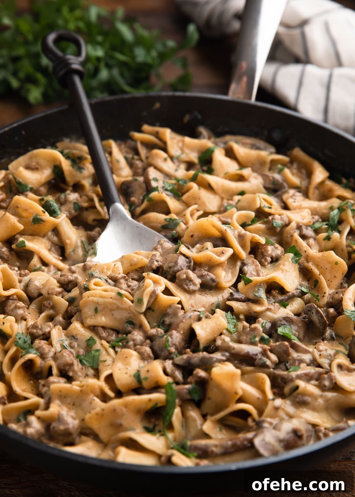 One-Pan Creamy Ground Beef Stroganoff Recipe 9 ground beef stroganoff in a large nonstick skillet with a serving spoon