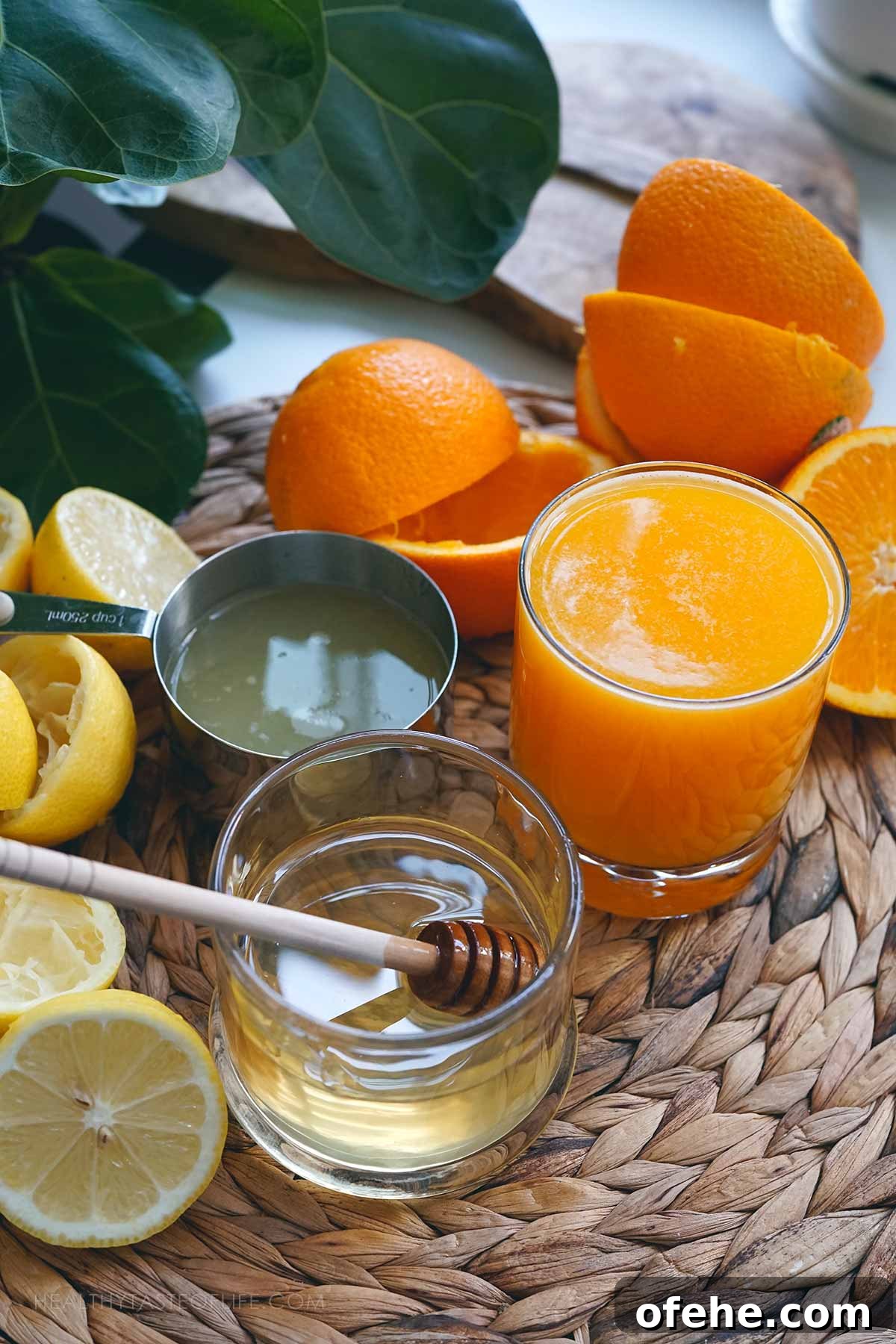 Fresh Orange Lemonade: 4-Ingredient Summer Orangeade Recipe 3 Ingredients needed for Making this Orange Lemonade recipe: (measured) displayed on a table along with freshly cut oranges and lemons.
