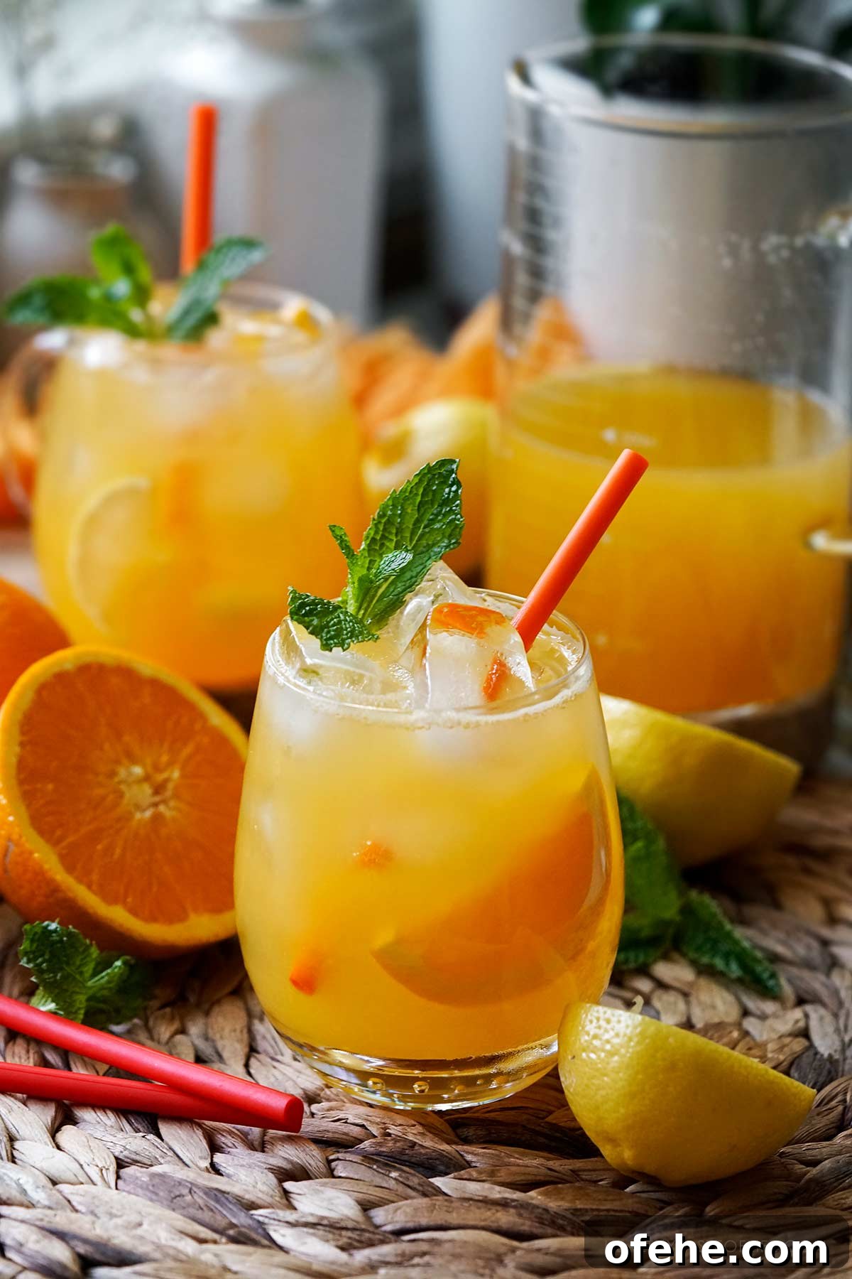 Fresh Orange Lemonade: 4-Ingredient Summer Orangeade Recipe 6 Orange lemonade aka orangeade served in glasses over ice and garnished with a slice of oarnge and lemon.