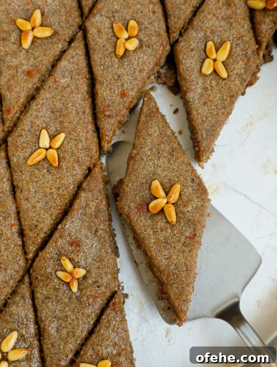 Lebanese Kibbeh Bil Sanieh: Baked Kibbeh Recipe from Lebanon 2 top down final shot of baked kibbeh showing one piece of kibbeh