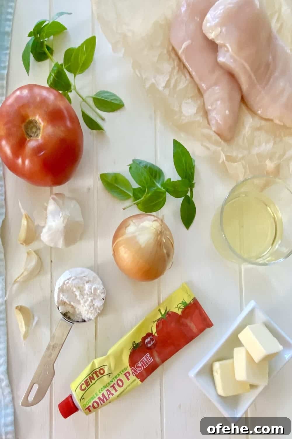 Butter-Sautéed Chicken Breast with Tomato, Wine & Basil Sauce 3 tomato, chicken, wine, onion, garlic, flour, butter