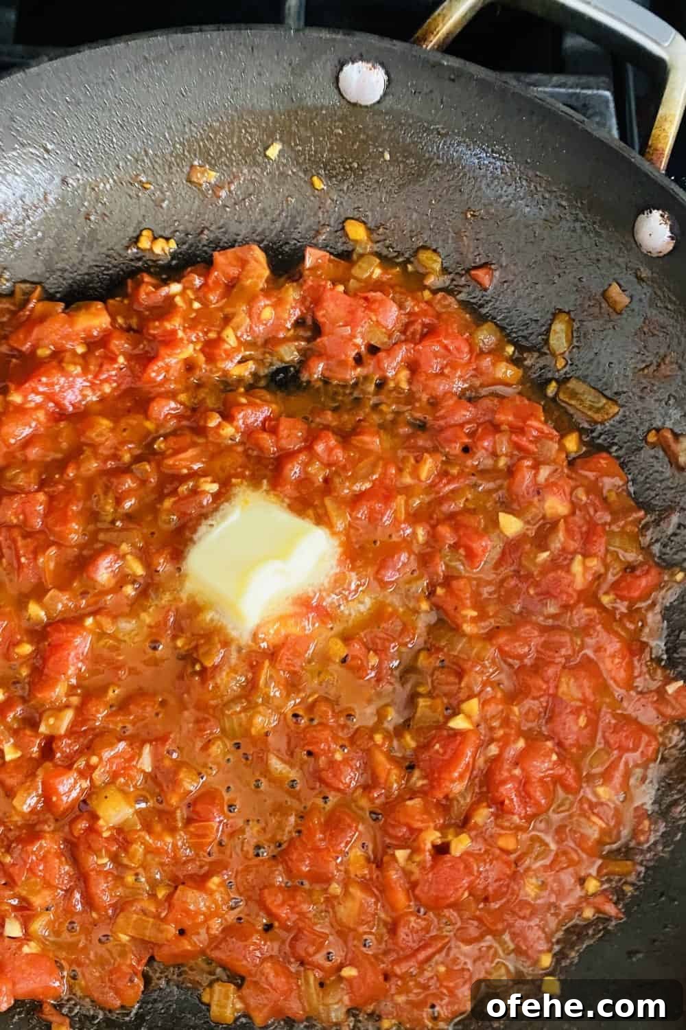 Butter-Sautéed Chicken Breast with Tomato, Wine & Basil Sauce 7 adding butter to tomato pan sauce