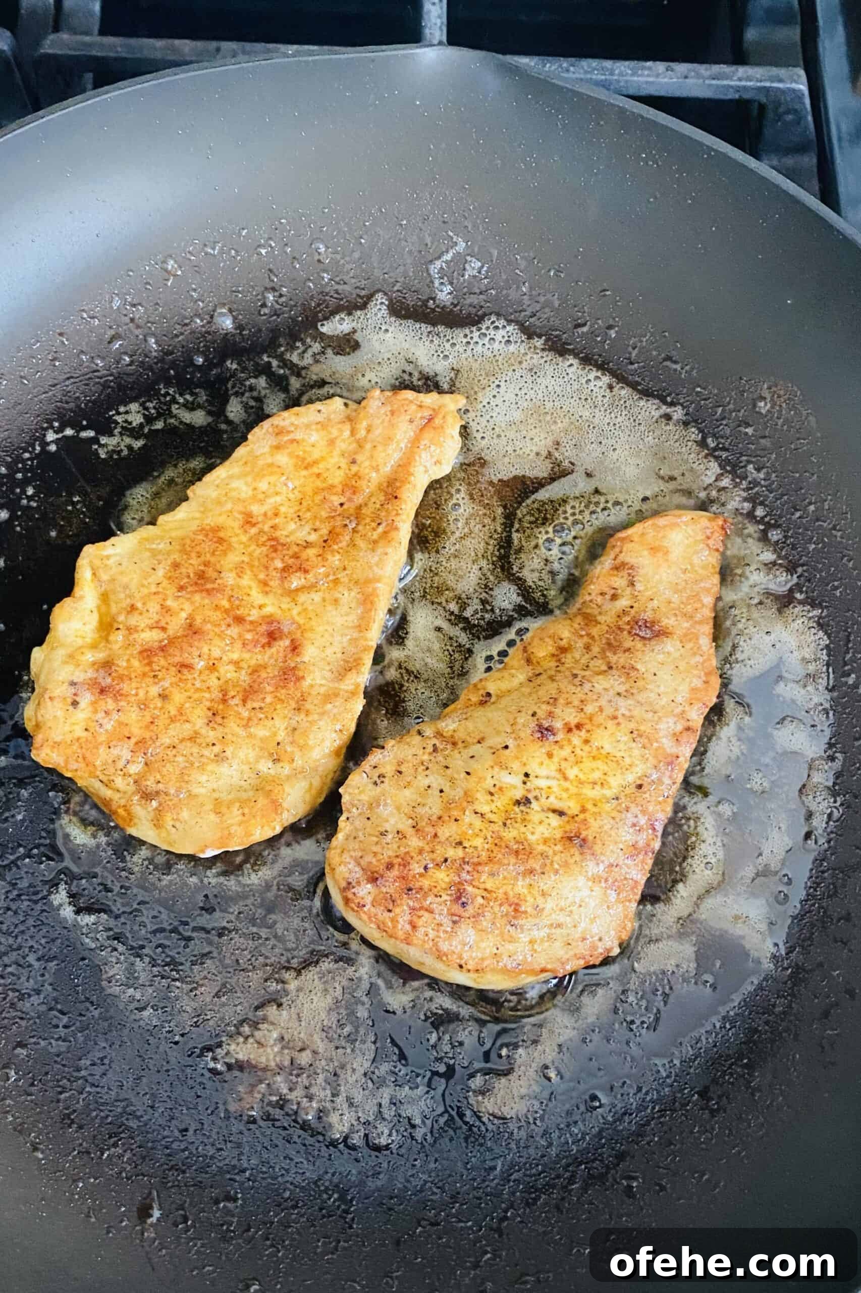 Butter-Sautéed Chicken Breast with Tomato, Wine & Basil Sauce 9 sauteing chicken in butter