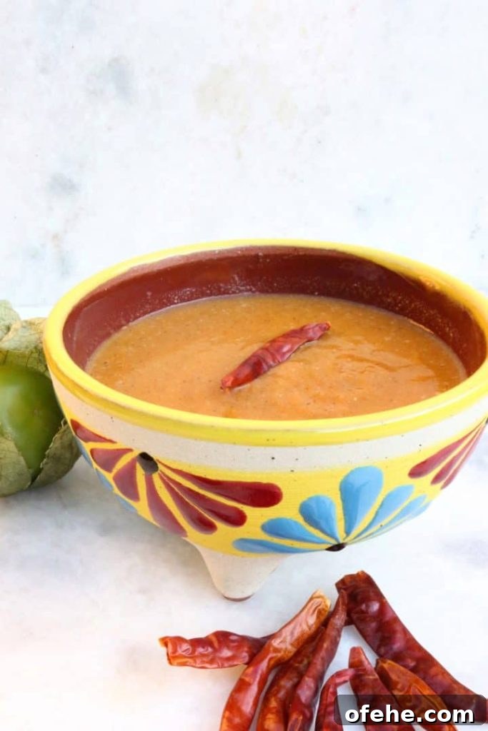 Roasted Tomatillo Salsa with Chile de Arbol Recipe 2 Roasted Tomatillo Salsa with a Chile de arbol and surrounded by more chiles and tomatillos
