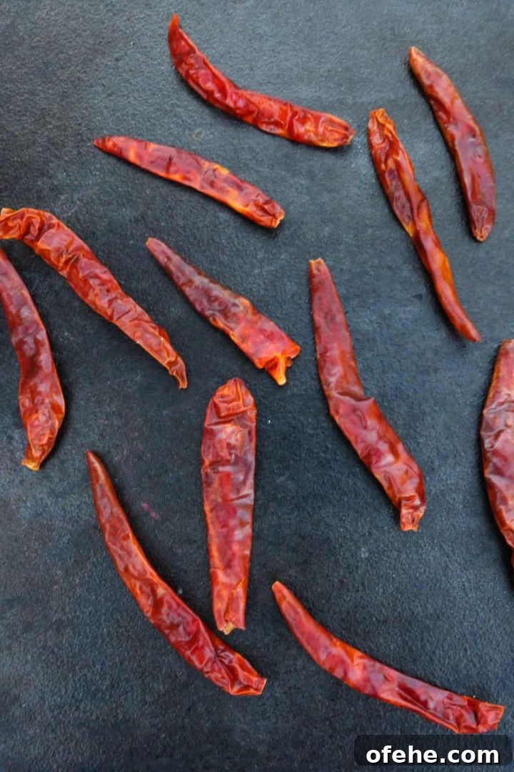 Roasted Tomatillo Salsa with Chile de Arbol Recipe 5 Chiles de arbol on a cast-iron comal