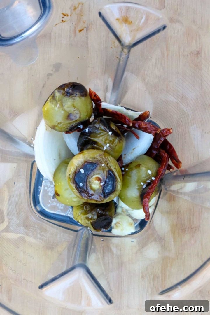 Roasted Tomatillo Salsa with Chile de Arbol Recipe 6 Tomatillos, chiles de arbol, onion and garlic in a blender.